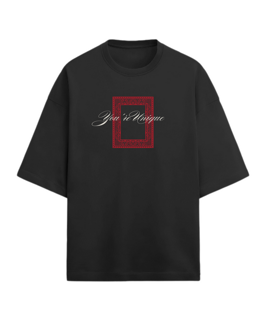 Black t-shirt with a red square design and text on a white background